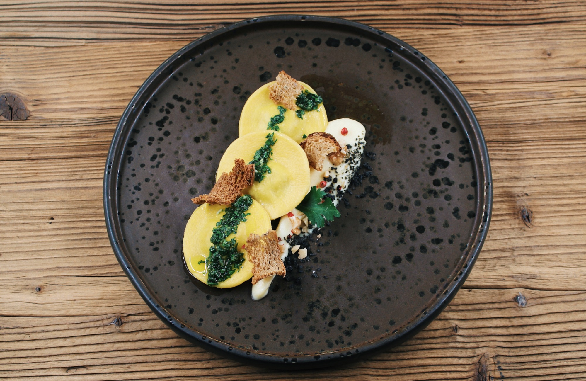 Ravioli with pieces of bread and a cream - Hotel Wieser
