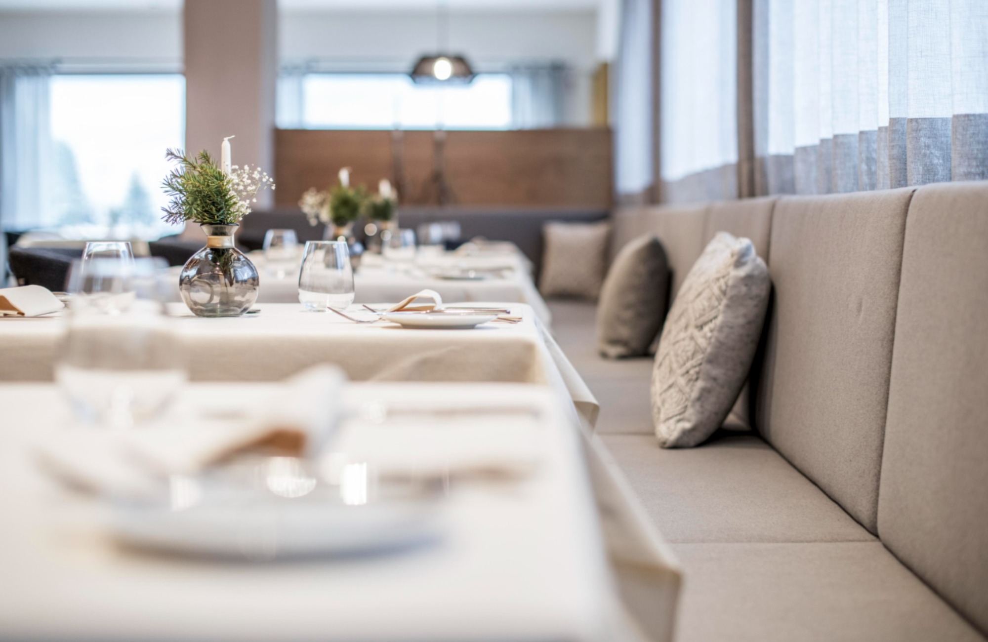 Set tables with gray benches - Hotel Wieser
