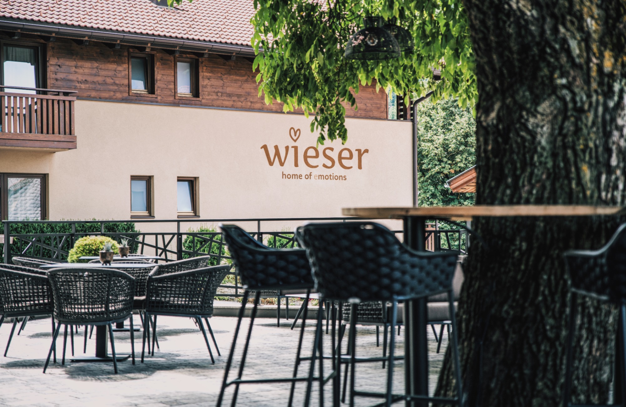 Hotel Wieser from the outside with the terrace in the foreground